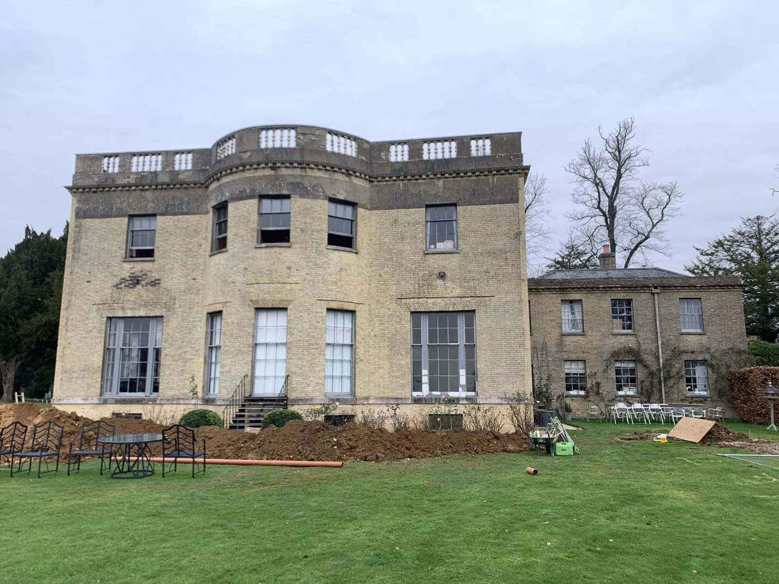 Stone Georgian country house seen across the lawn