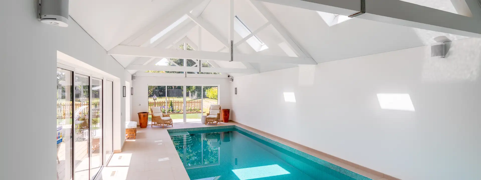 Indoor pool room with a glazed wall